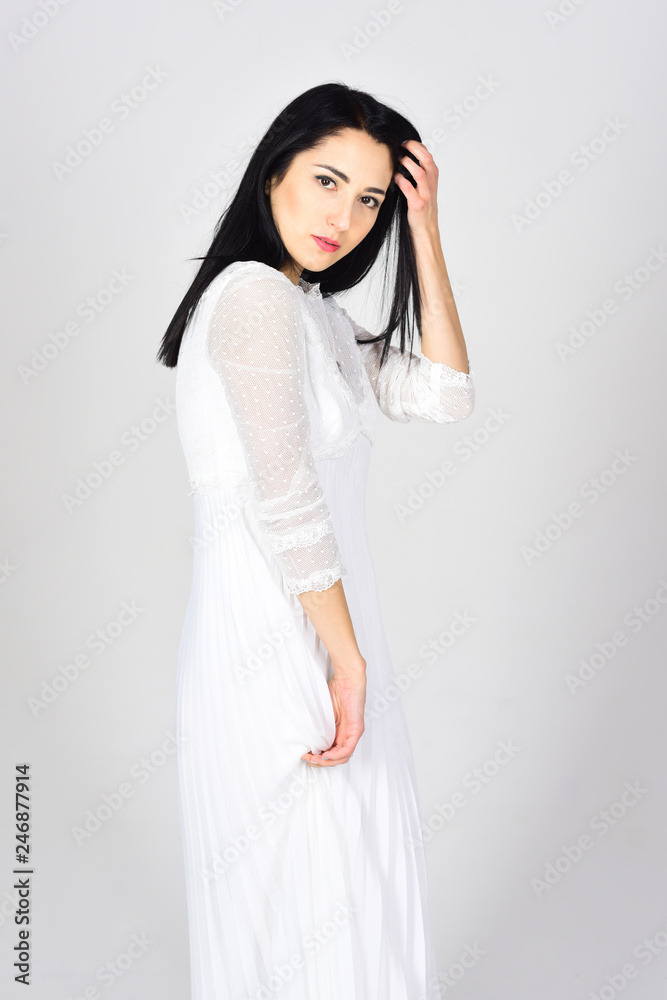 Woman in white dress. Wedding dress fashion. Fashion portrait of woman. Beauty salon and hairdresser. Sexy woman with natural makeup. Real admiration. Following her personal style Woman in white dress. Wedding dress fashion. Fashion portrait of woman. Beauty salon and hairdresser. Sexy woman with natural makeup. Real admiration. Following her personal style