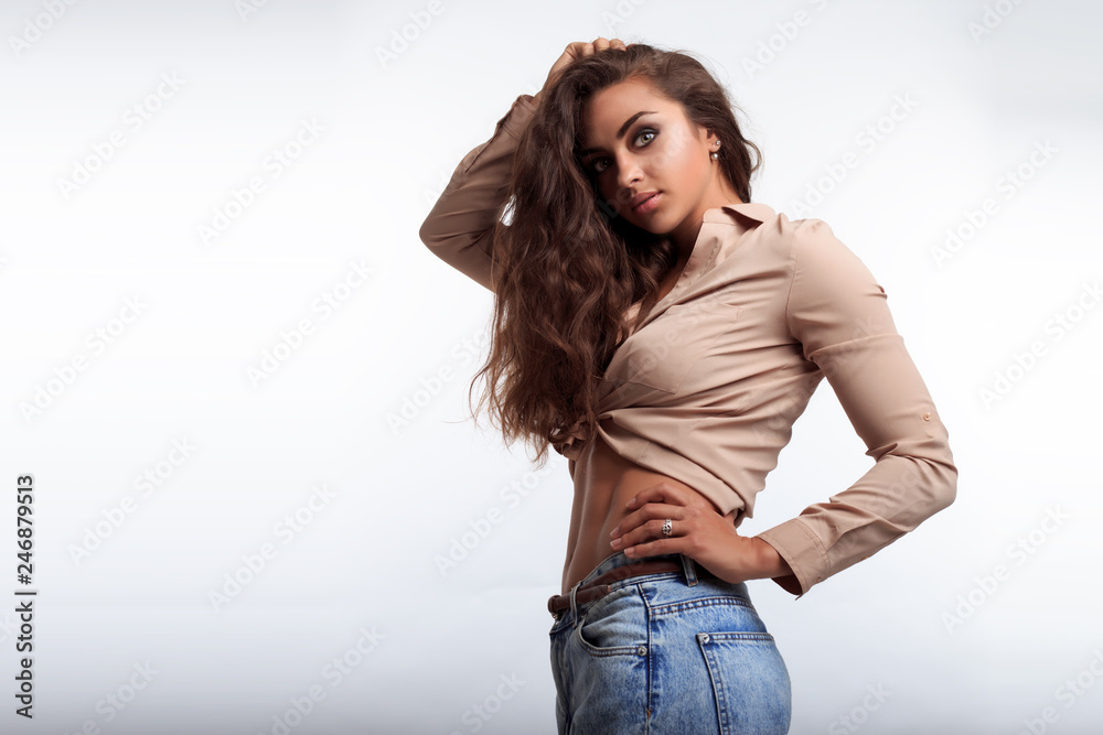 Attractive woman with flat belly and shaped abdominal. Sporty girl