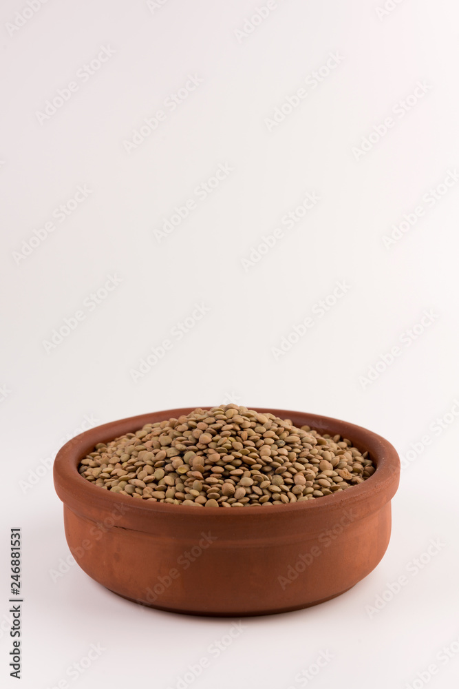 Yellow lentil in a bowl isolated on white background Yellow lentil in a bowl isolated on white background