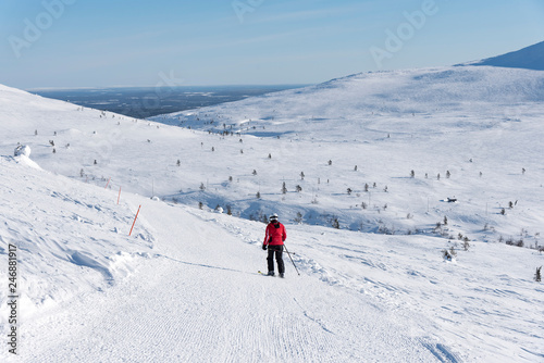 Woman downhill skiing in Lapland Finland