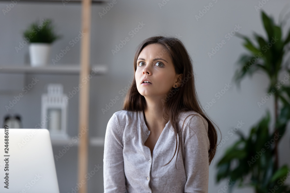 Shocked female worker feeling stressed suddenly remembered about forgot deadline, anxious horrified teen student woman employee thinking of work undone at workplace worried about bad results Shocked female worker feeling stressed suddenly remembered about forgot deadline, anxious horrified teen student woman employee thinking of work undone at workplace worried about bad results