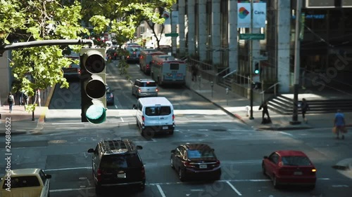 Downtown San Francisco traffic at Embarcadero Center. Traffic light in foreground.