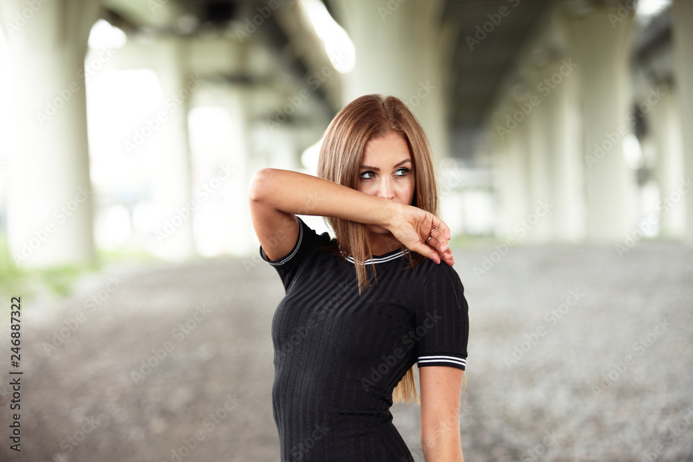 Amazing body brunette girl posing for photo at the street