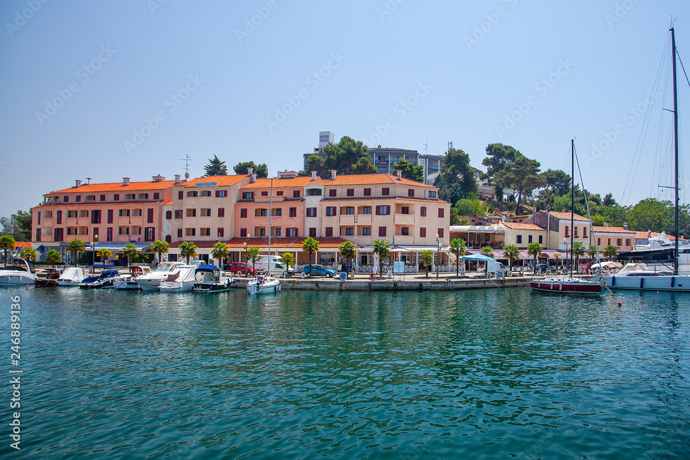 View from the sea on the old historic town of Porec, Croatia.