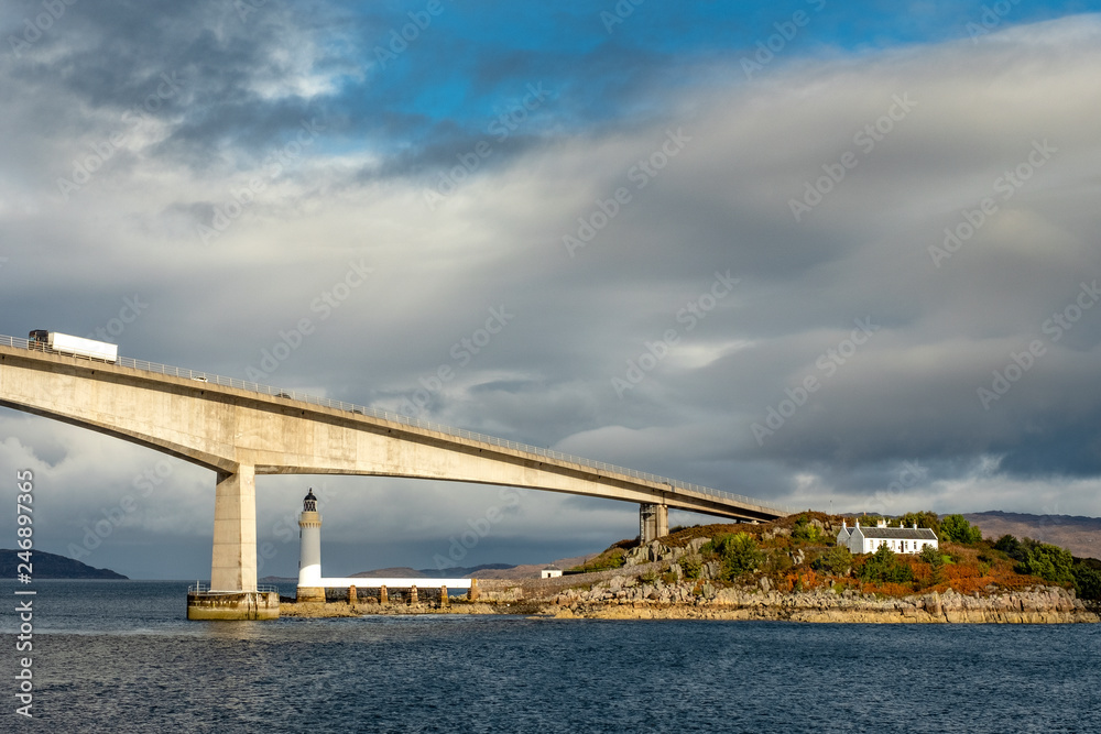 Obraz premium Lighthouse under the tall bridge, Scotland, UK