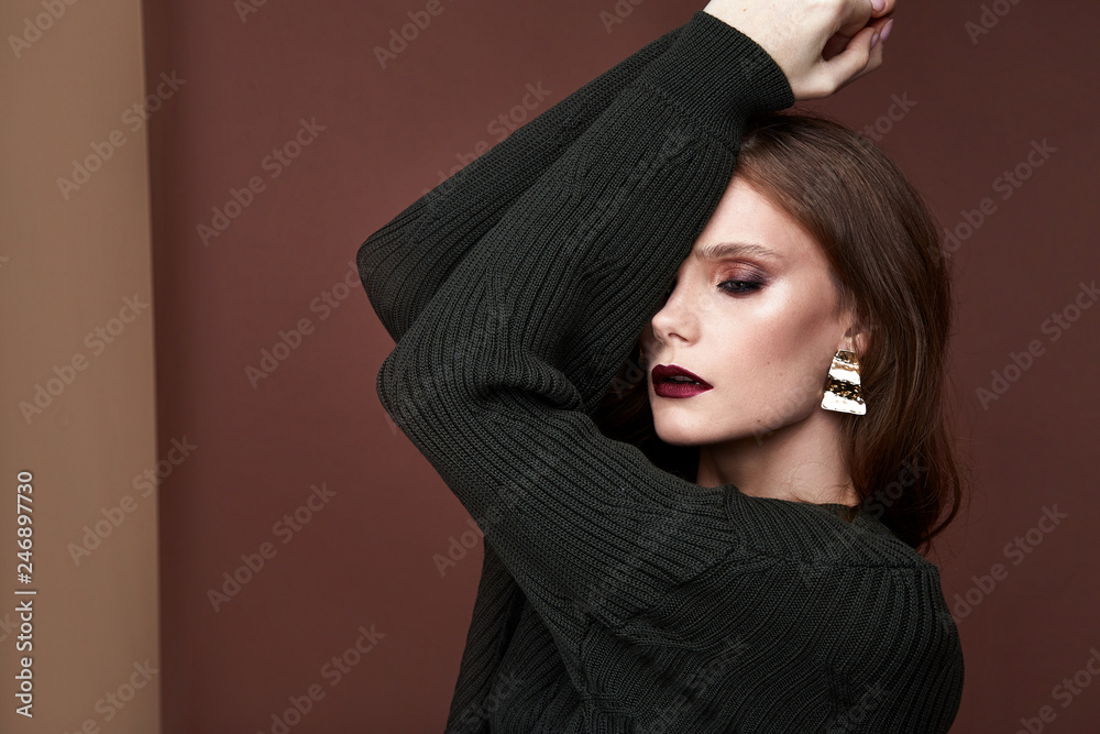 Glamour beautiful sexy brunette women, looks like a model, wearing evening make up in skinny knitted dress in fashion pose perfect shape girl hairdo jewelry makeup lashes beauty salon portrait. Glamour beautiful sexy brunette women, looks like a model, wearing evening make up in skinny knitted dress in fashion pose perfect shape girl hairdo jewelry makeup lashes beauty salon portrait.