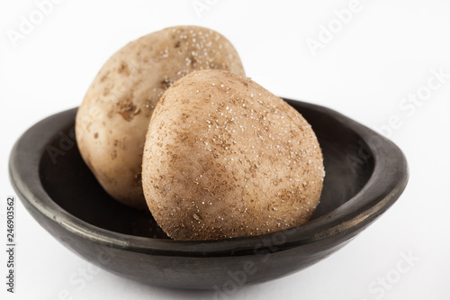 Traditional Colombian cooked potatoes called papas saladas isolated on white background