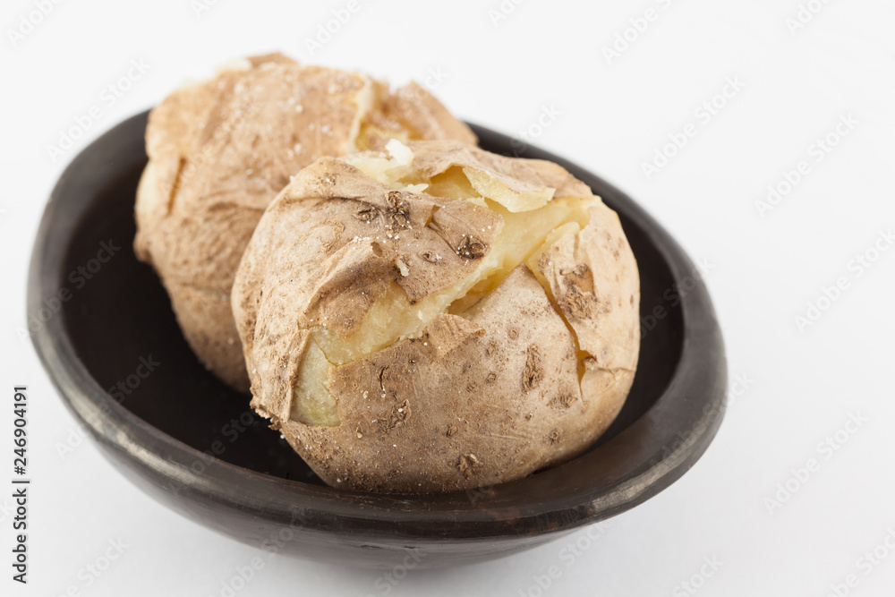 Traditional Colombian cooked potatoes called papas saladas isolated on white background
