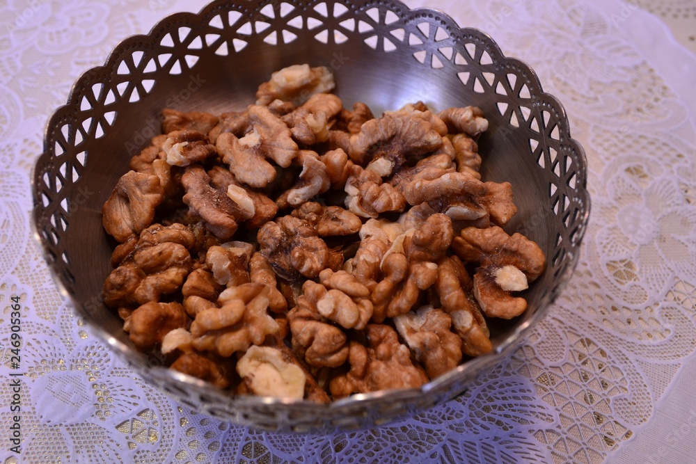 Walnuts peeled in a vase on the table
