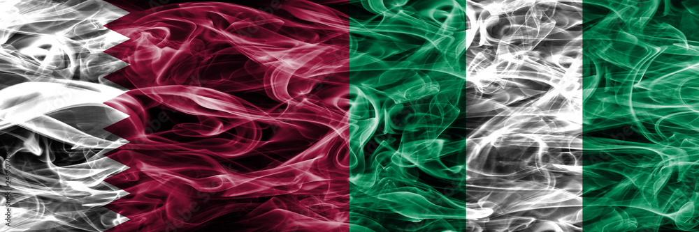 Fototapeta premium Qatar vs Nigeria, Nigerian smoke flags placed side by side. United Arab Emirates. UAE.