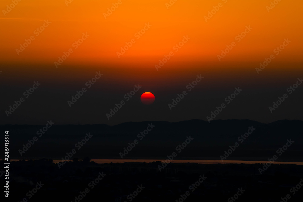 A beautiful view at Irrawaddy River in Mandalay , Myanmar at sunset time twilight sky before dark time coming A beautiful view at Irrawaddy River in Mandalay , Myanmar at sunset time twilight sky before dark time coming