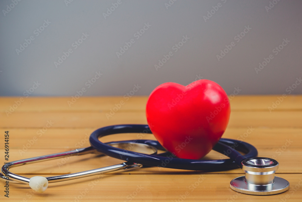 Close up red heart and steythoscope on old wood table and world health day and healthcare technology concept, vintage tone - Image Close up red heart and steythoscope on old wood table and world health day and healthcare technology concept, vintage tone - Image