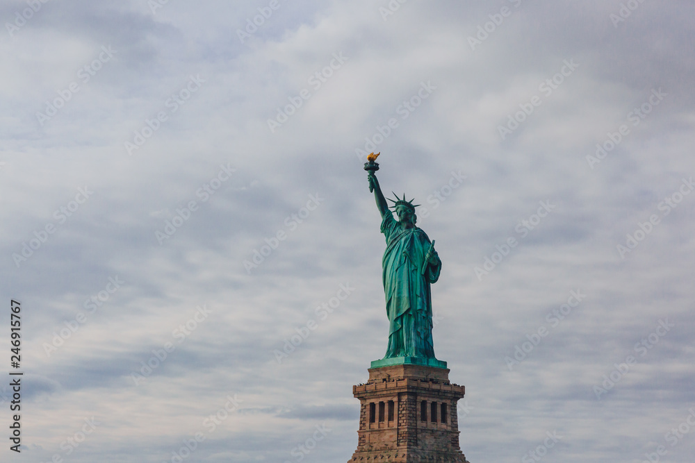 Statue of Liberty against sky and clouds, in New York City, USA Statue of Liberty against sky and clouds, in New York City, USA