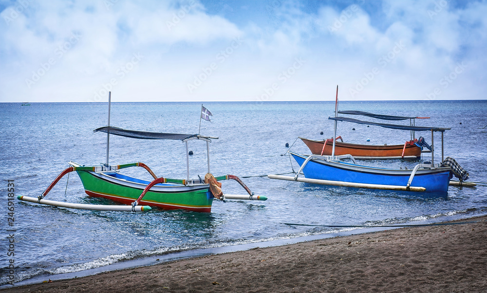Fototapeta premium Typical indoensian boats called jukung on the beach of Lovina Bali Indonesia