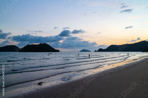 Sea wave moving to the beach with green islands and blue  yellow sky in background at the evening in Koh Mak Island at Trat  Thailand.