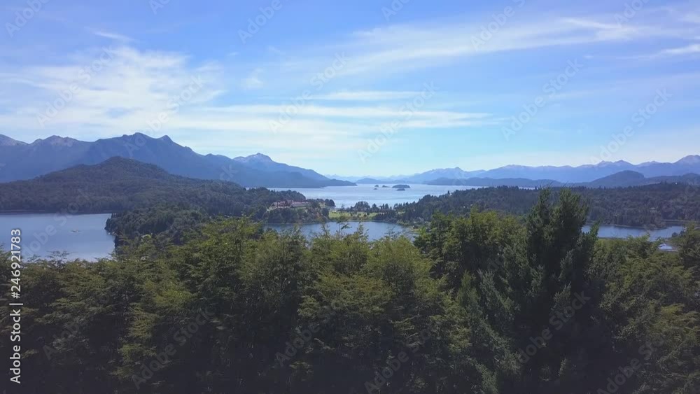 Aerial view of the lake of Nahuel Huapi near the town of Bariloche in Patagonia, Argentina. Camera slowly ascends over the trees of foreground Aerial view of the lake of Nahuel Huapi near the town of Bariloche in Patagonia, Argentina. Camera slowly ascends over the trees of foreground