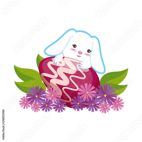 cute rabbit with easter egg painted in the garden © Gstudio