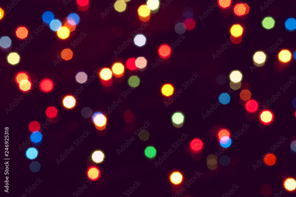 Small bright lights on a dark background - out of focus