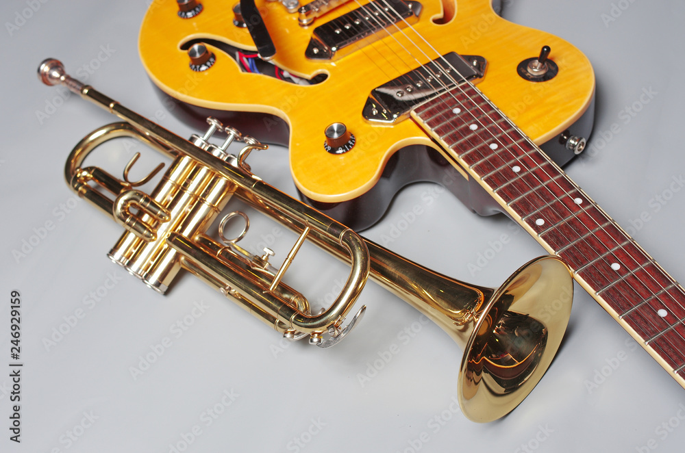 Trumpet and electric guitar. Musical instruments Trumpet and electric guitar. Musical instruments