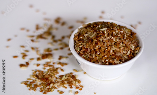 Brown rice on white background. 