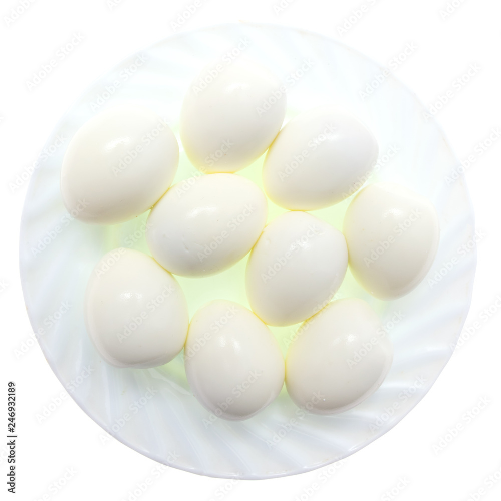 Peeled boiled eggs in a plate on a white background Peeled boiled eggs in a plate on a white background
