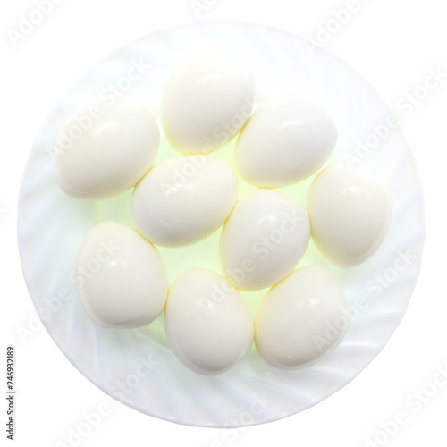 Peeled boiled eggs in a plate on a white background