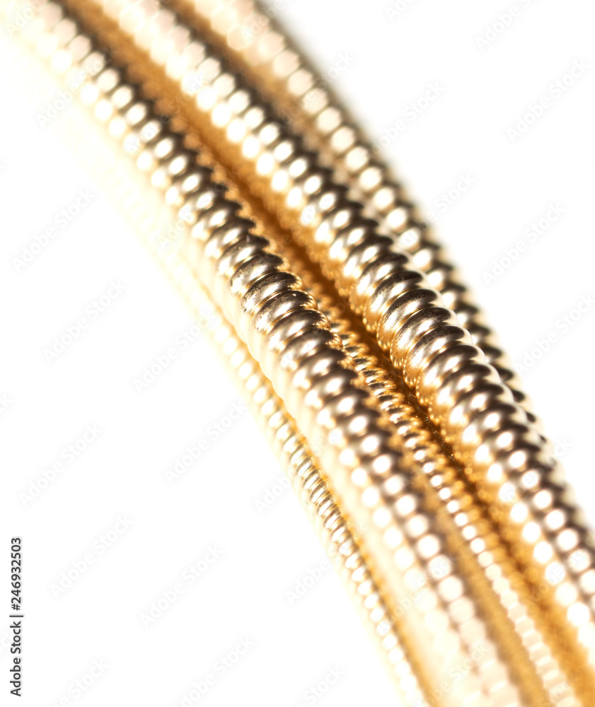 Strings for guitar isolated on a white background Strings for guitar isolated on a white background