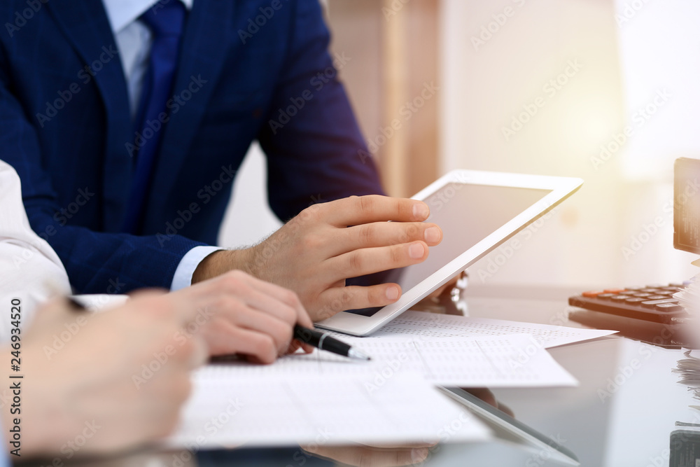 Businessman using laptop at meeting, closeup of hands. Business operations concept Businessman using laptop at meeting, closeup of hands. Business operations concept