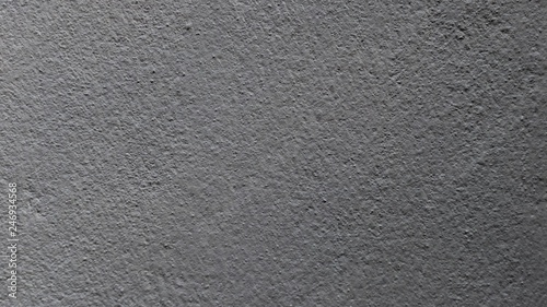 Abstract background of dark gray cement wall.