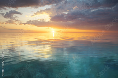 Fototapeta Naklejka Na Ścianę i Meble -  Sky background and water reflection on sunset