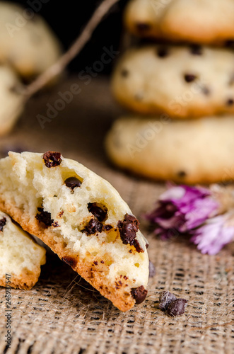 homemade cookies with chocolate drops filling on a black background