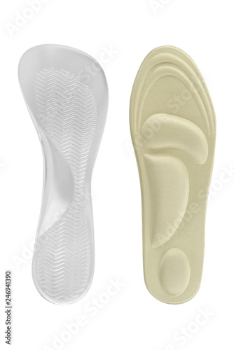 Orthopedic insoles for shoes  health accessories for walking. Textile and silicon insoles isolated on white background  clipping path included