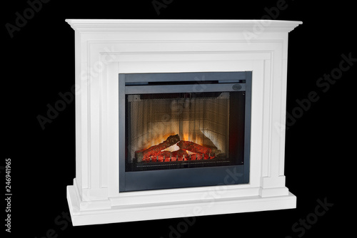 White wooden burning fireplace with roaring flames, classic elegant design. Isolated on black background, clipping path included. Fireplace as a piece of furniture