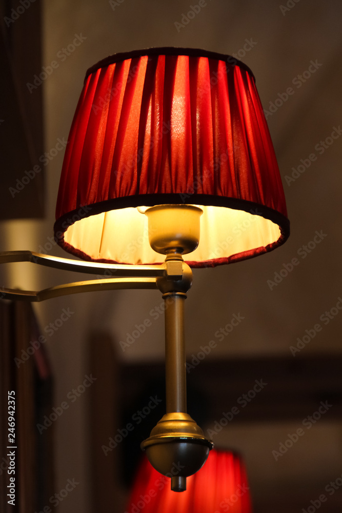 Yellow and red lamp in a dark cafe