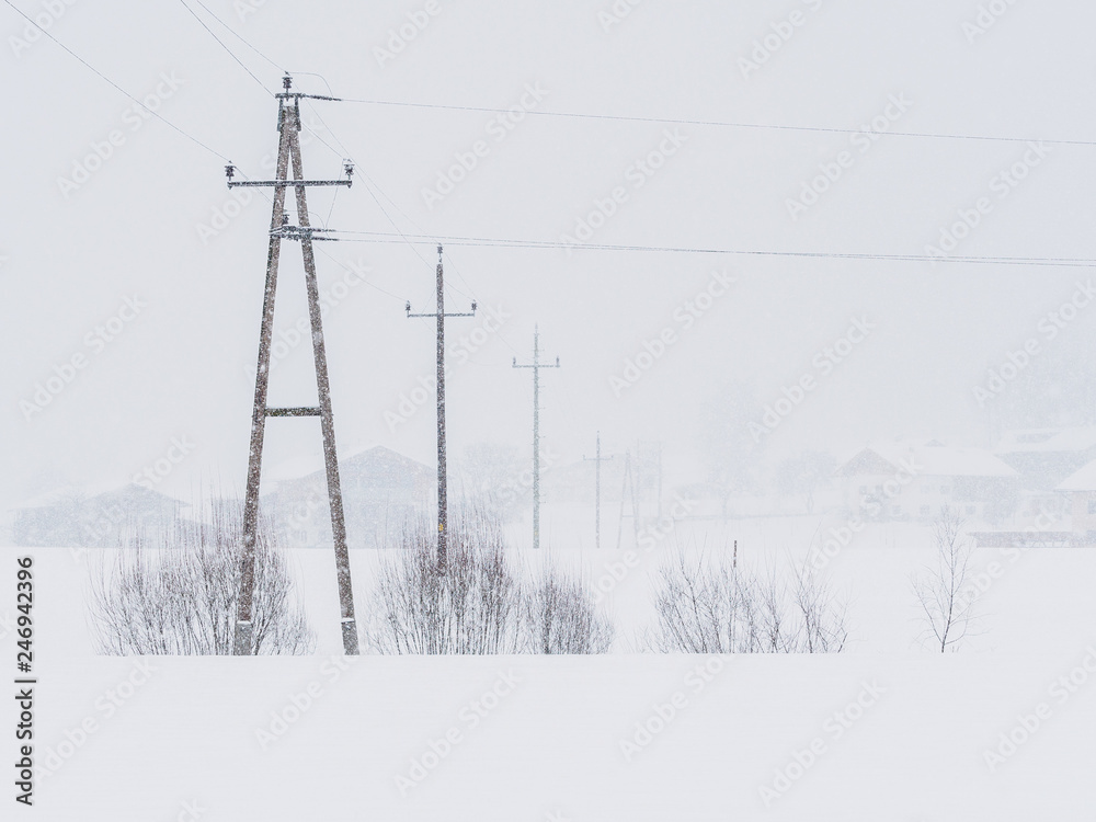 Power lines in the snowstorm in Ebbs, Tirol, Austria