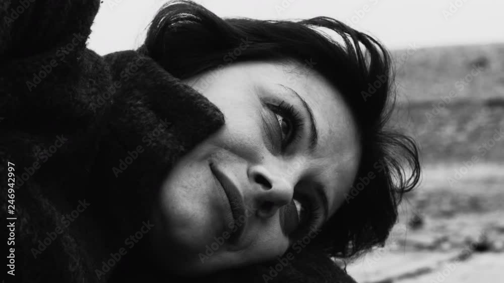 Woman feeling down on a overcast day. Depression and Nostalgia. Black and white and color 4k video