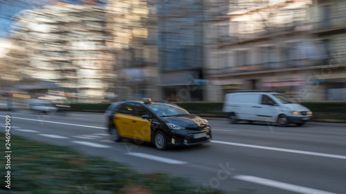 Panning of a taxi cab in the street of Barcelona Spain
