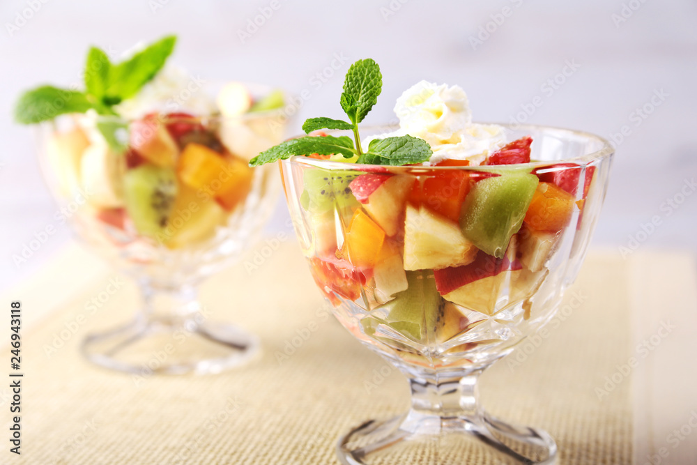 Diet-Fresh tasty mix fruit salad in the bowl on the wooden table, healthy breakfast, weight loss concept. Diet-Fresh tasty mix fruit salad in the bowl on the wooden table, healthy breakfast, weight loss concept.