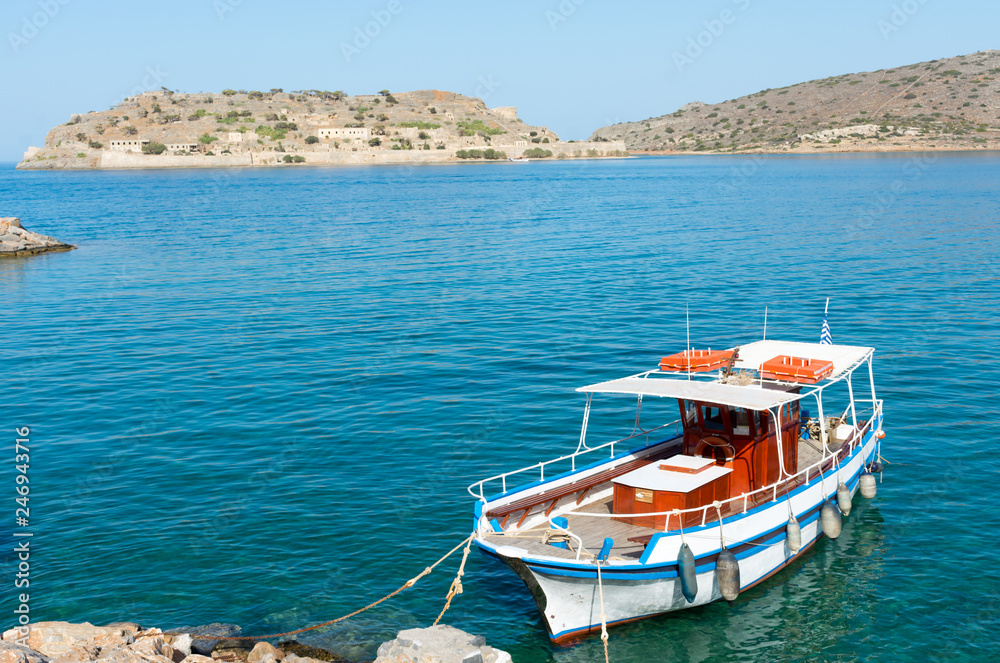 Crete. Pleasure boat near the pier to transport tourists to the island of Spinalonga