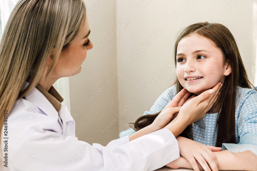 Doctor consulting and check up information with little girl in hospital.A little girl has sick.healthcare and medicine Doctor consulting and check up information with little girl in hospital.A little girl has sick.healthcare and medicine