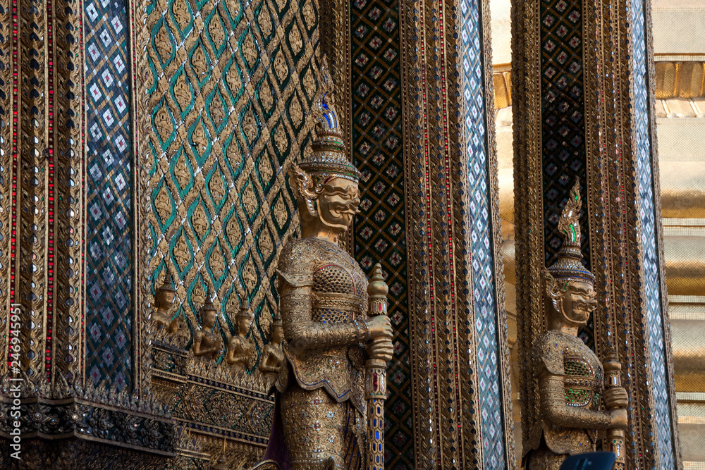 Bangkok Thailand, guardians at the entrance to ornate temple building
