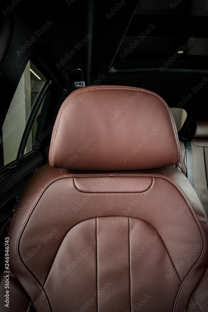 Red perforated leather driver seat with stitching inside luxury car  interior Stock Photo | Adobe Stock