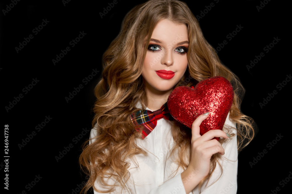 Valentine's Day. Beautiful girl with heart. Woman with red shiny heart.
Valentine's Day. Beautiful girl with heart. Woman with red shiny heart.