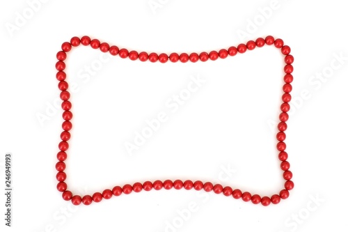 Red beads in the form of a frame for text or image isolated on white background