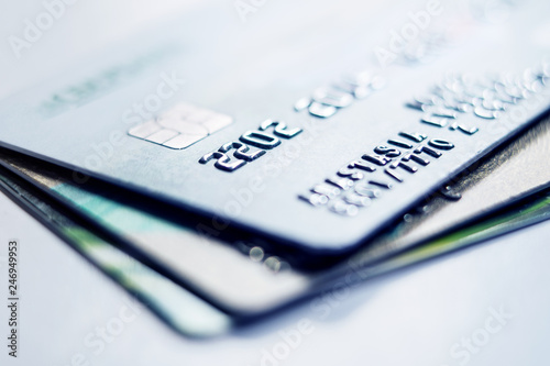 Debit bank cards on a light background. Credit cards stacked on light background