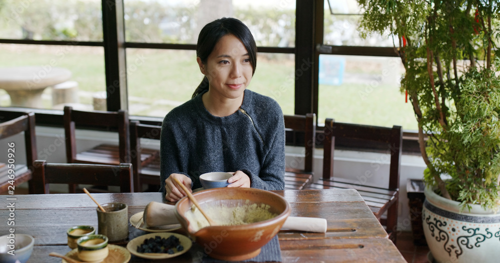 Woman drinking Chinese ground tea Woman drinking Chinese ground tea