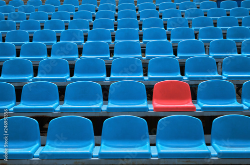 Empty seats in a stadium with one special