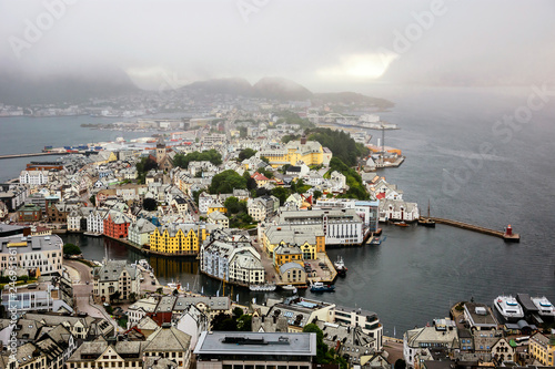 Panoramic view of the archipelago, the beautiful Alesund town centre and the amazing Sunnmore Alps from Fjellstua  Viewpoint, More og Romsdal, Norway photo