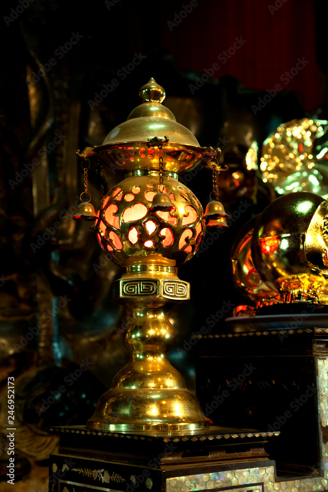 Gild lamp in a buddhist Temple, Vietnam