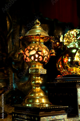 Gild lamp in a buddhist Temple, Vietnam